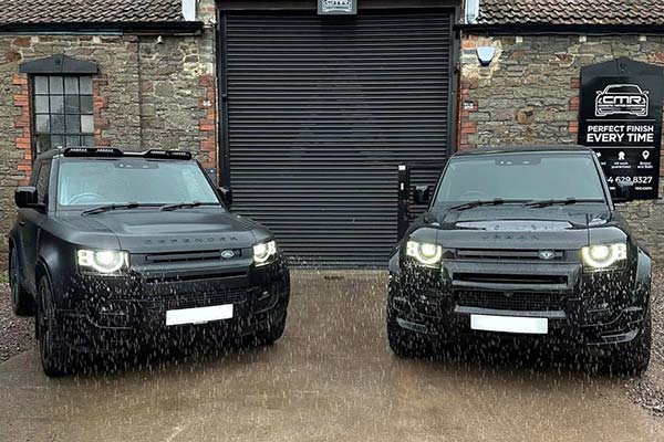 two-car-outside-workshop